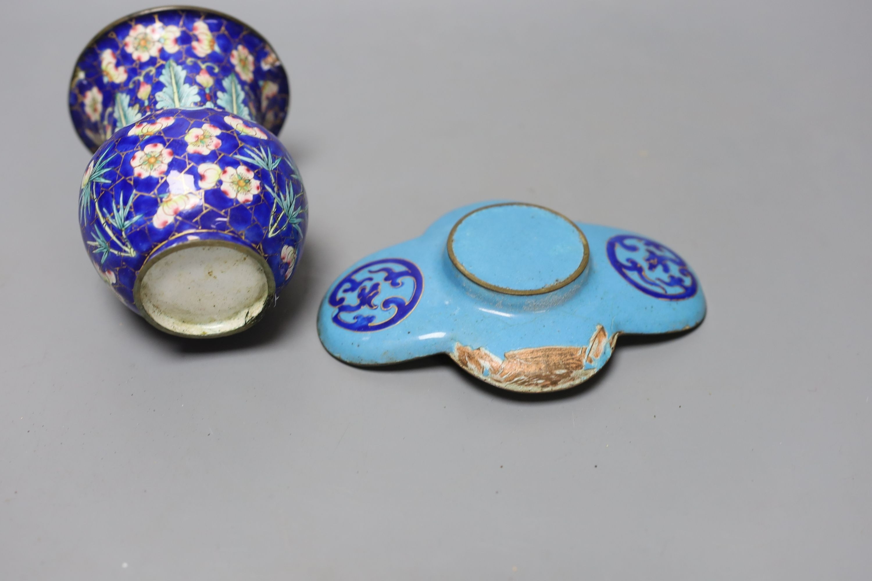 A group of 19th century Canton enamelled wares, including a vase and stand, two tea bowls and saucers and two dishes